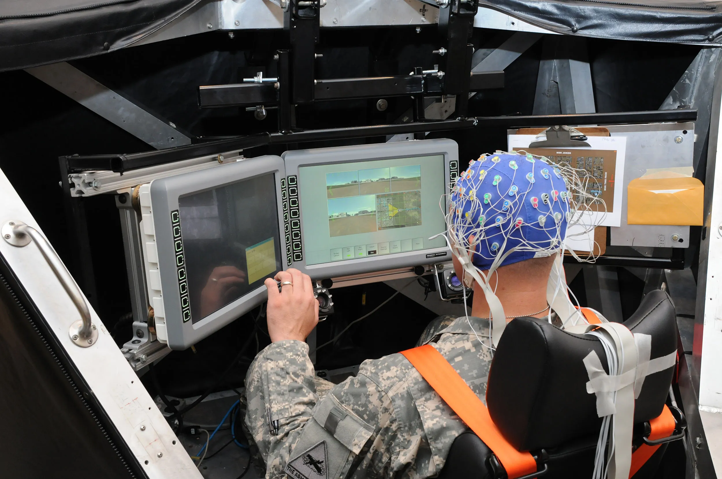 Above — U.S. Army troops practice traditional human intelligence. At top — an experimental system that links a soldier’s brain with a computer. U.S. Army photos